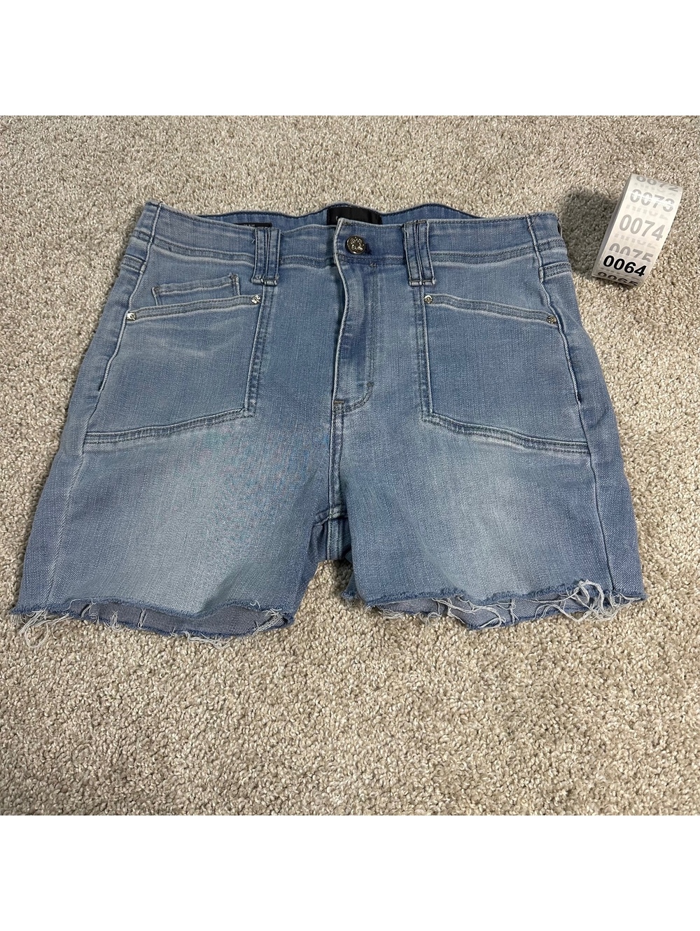 Kick Flare light wash high rise frayed denim shorts